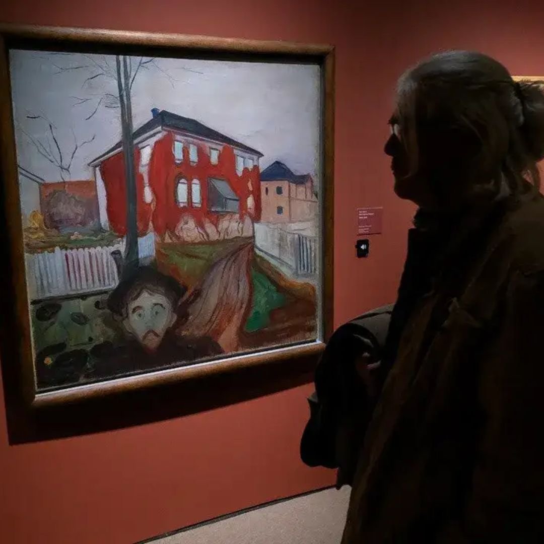 Person looking at a painting at the KODE art museum